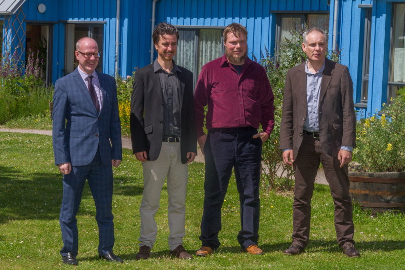 Scottish Housing Minister Kevin Stewart, PET Project Manager Paddy Atkinson, Project Builder Jason Caddy of Greenleaf Design & Build and local MSP Richard Lochead